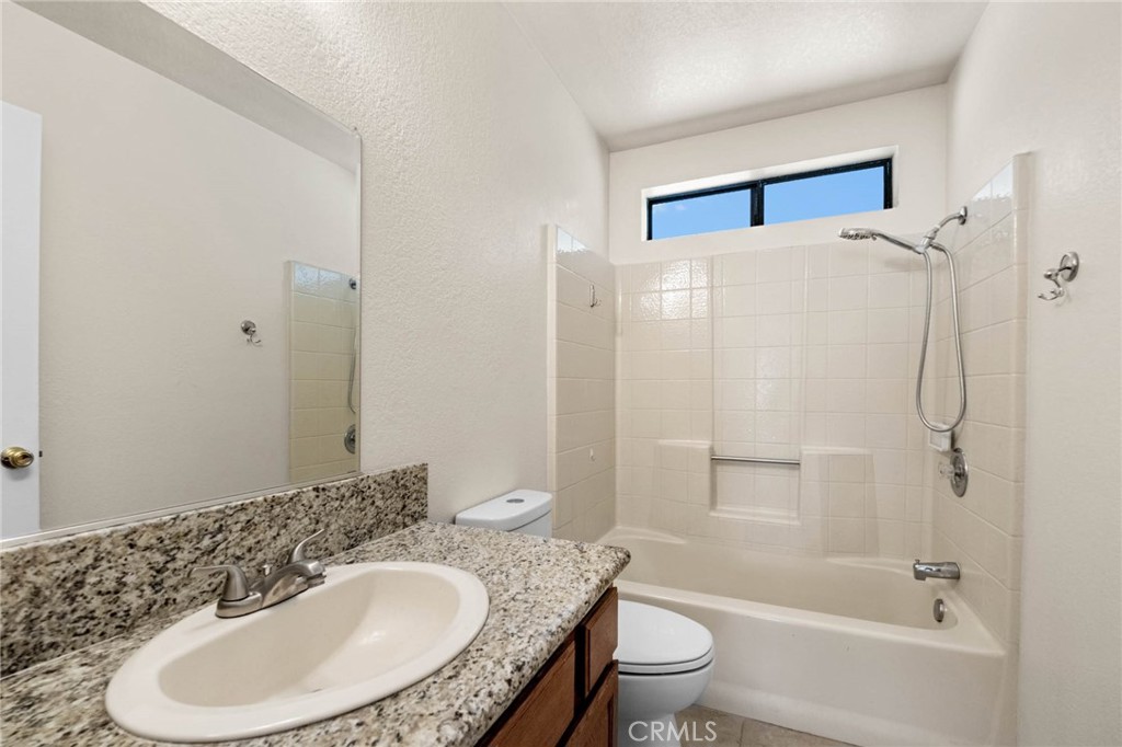 13904 Hidden Valley Road Victorville, CA 92395 - Photo 19 of 47 a bathroom with a sink toilet and shower