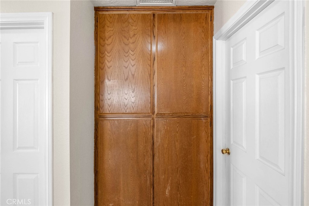 13904 Hidden Valley Road Victorville, CA 92395 - Photo 21 of 47 a bathroom with a glass shower door