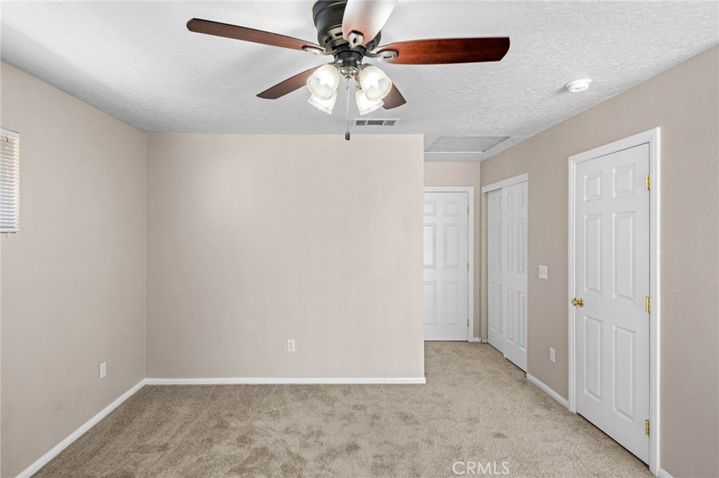 13904 Hidden Valley Road Victorville, CA 92395 - Photo 22 of 47 wooden floor in an empty room