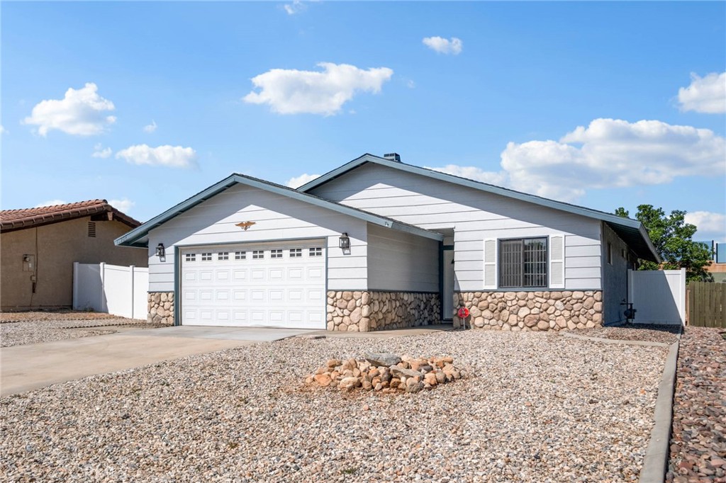 13904 Hidden Valley Road Victorville, CA 92395 - Photo 29 of 47 a view of house with yard