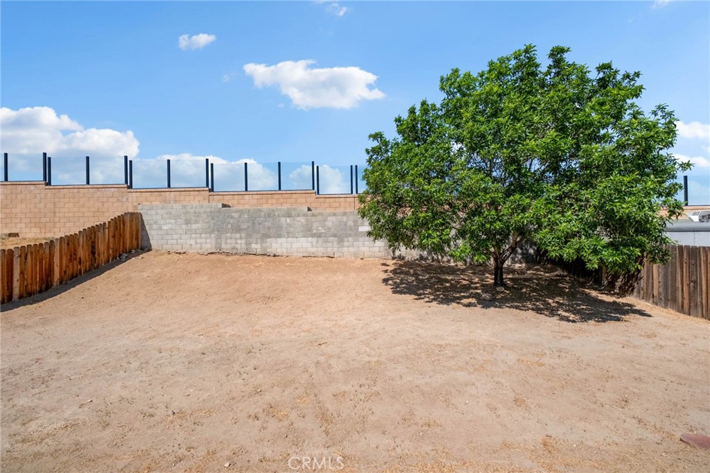 13904 Hidden Valley Road Victorville, CA 92395 - Photo 37 of 47 a view of a house with a yard