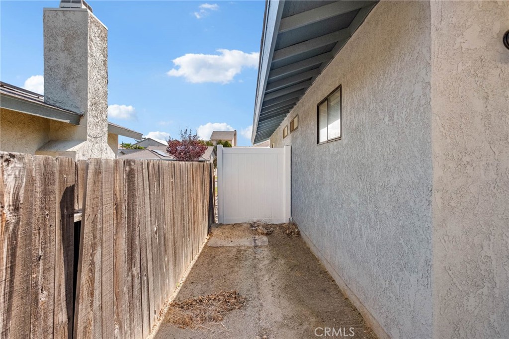 13904 Hidden Valley Road Victorville, CA 92395 - Photo 42 of 47 a view of a house with a backyard