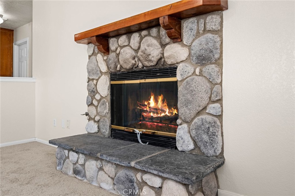 13904 Hidden Valley Road Victorville, CA 92395 - Photo 6 of 47 a living room with furniture and a fireplace