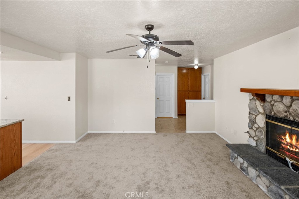 13904 Hidden Valley Road Victorville, CA 92395 - Photo 8 of 47 a view of an empty room and fire place