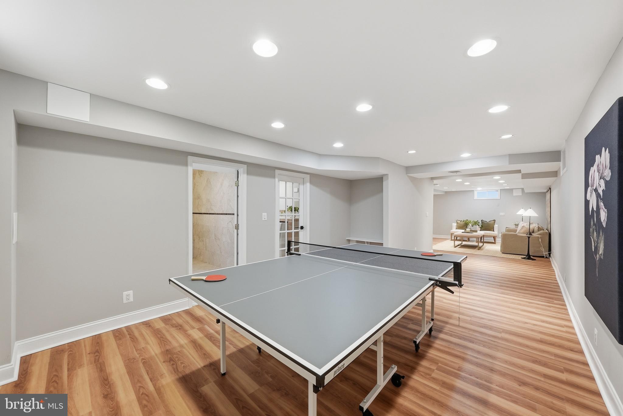 1291 Lamplighter Way Reston, VA 20194 - Photo 50 of 60 a room with wooden floor table and chairs