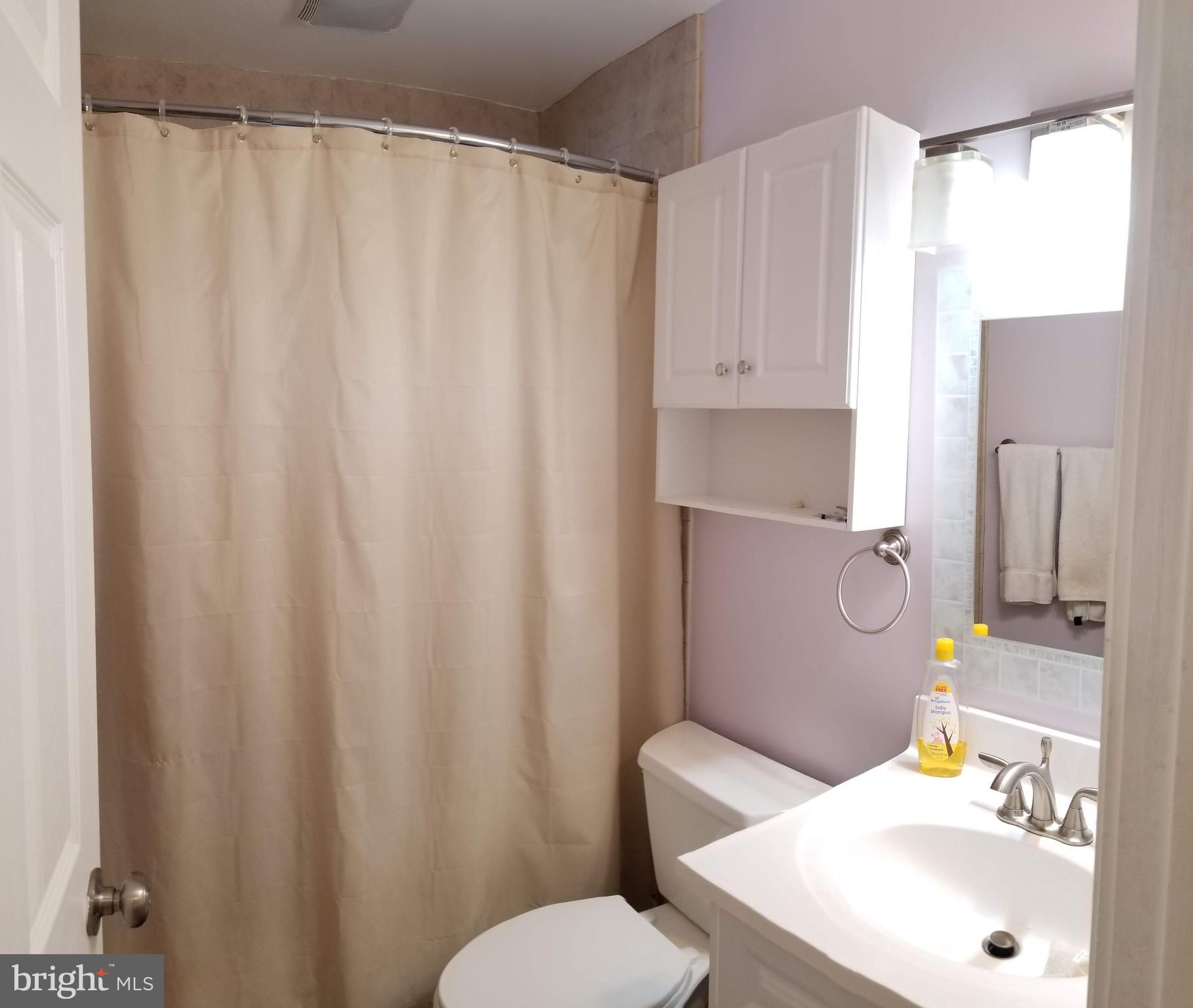 303 East Poplar Road Sterling, VA 20164 - Photo 11 of 12 REMODELED HALL BATH