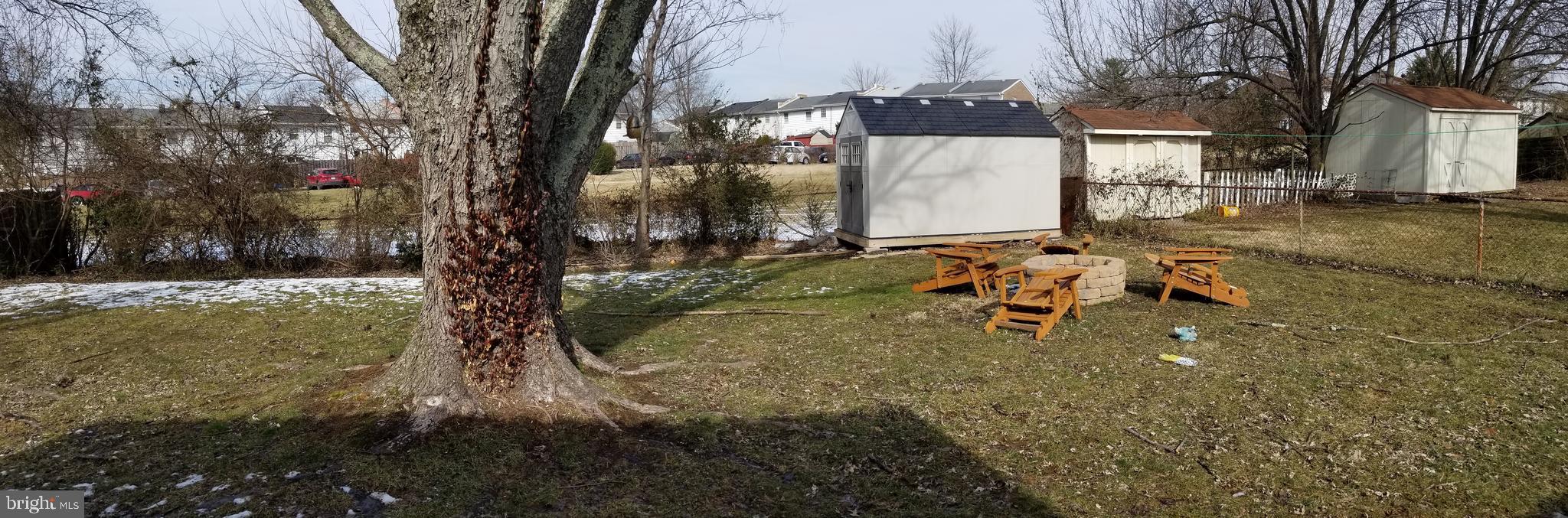 303 East Poplar Road Sterling, VA 20164 - Photo 12 of 12 FENCED YARD WITH FIRE PIT