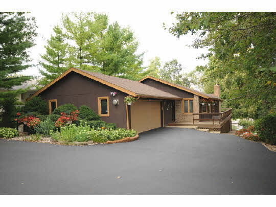7 Lake Summerset Road Lake Summerset, IL 61019 - Photo 1 of 11 a front view of house with a garden