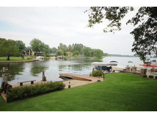 7 Lake Summerset Road Lake Summerset, IL 61019 - Photo 2 of 11 a swimming pool with outdoor seating and garden