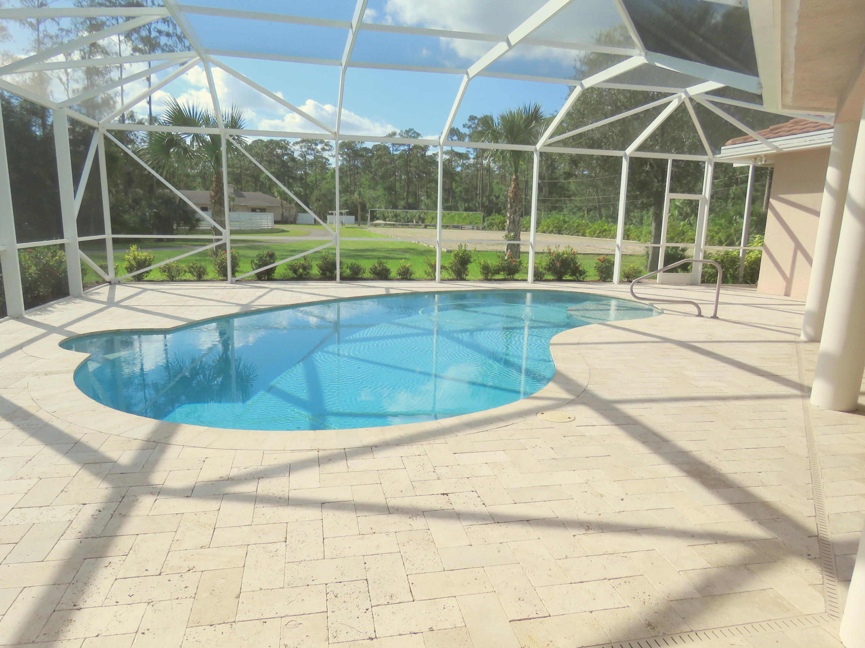 1059 E Road Loxahatchee, FL 33470 - Photo 11 of 82 a view of outdoor space with swimming pool