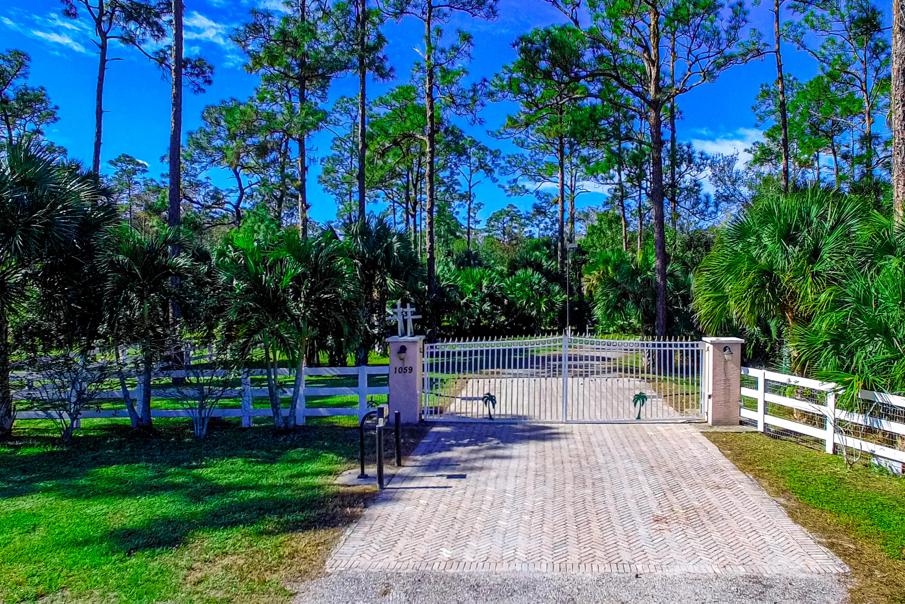 1059 E Road Loxahatchee, FL 33470 - Photo 2 of 82 ELECTRIC GATED ENTRANCE