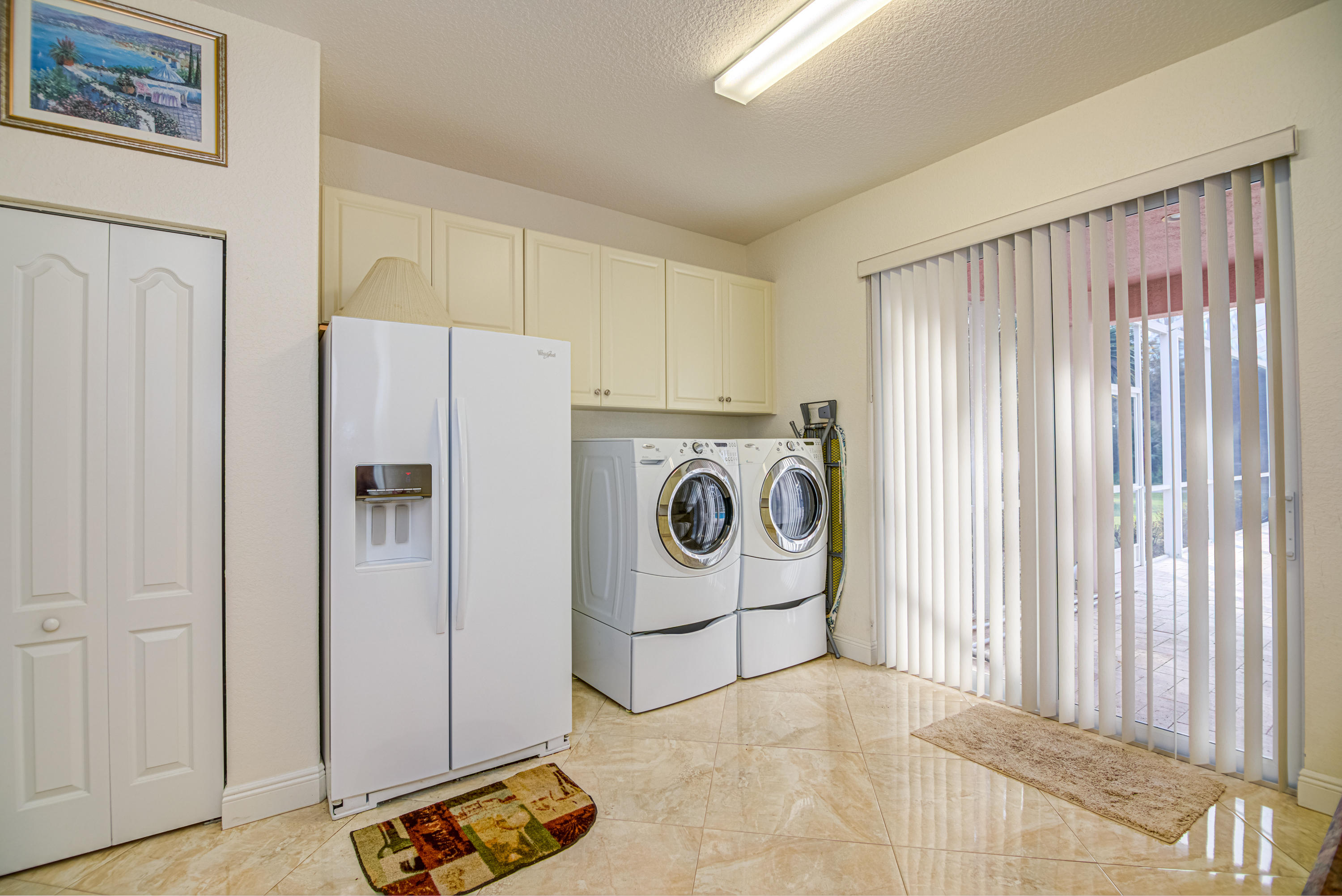1059 E Road Loxahatchee, FL 33470 - Photo 26 of 82 a utility room with dryer and washer