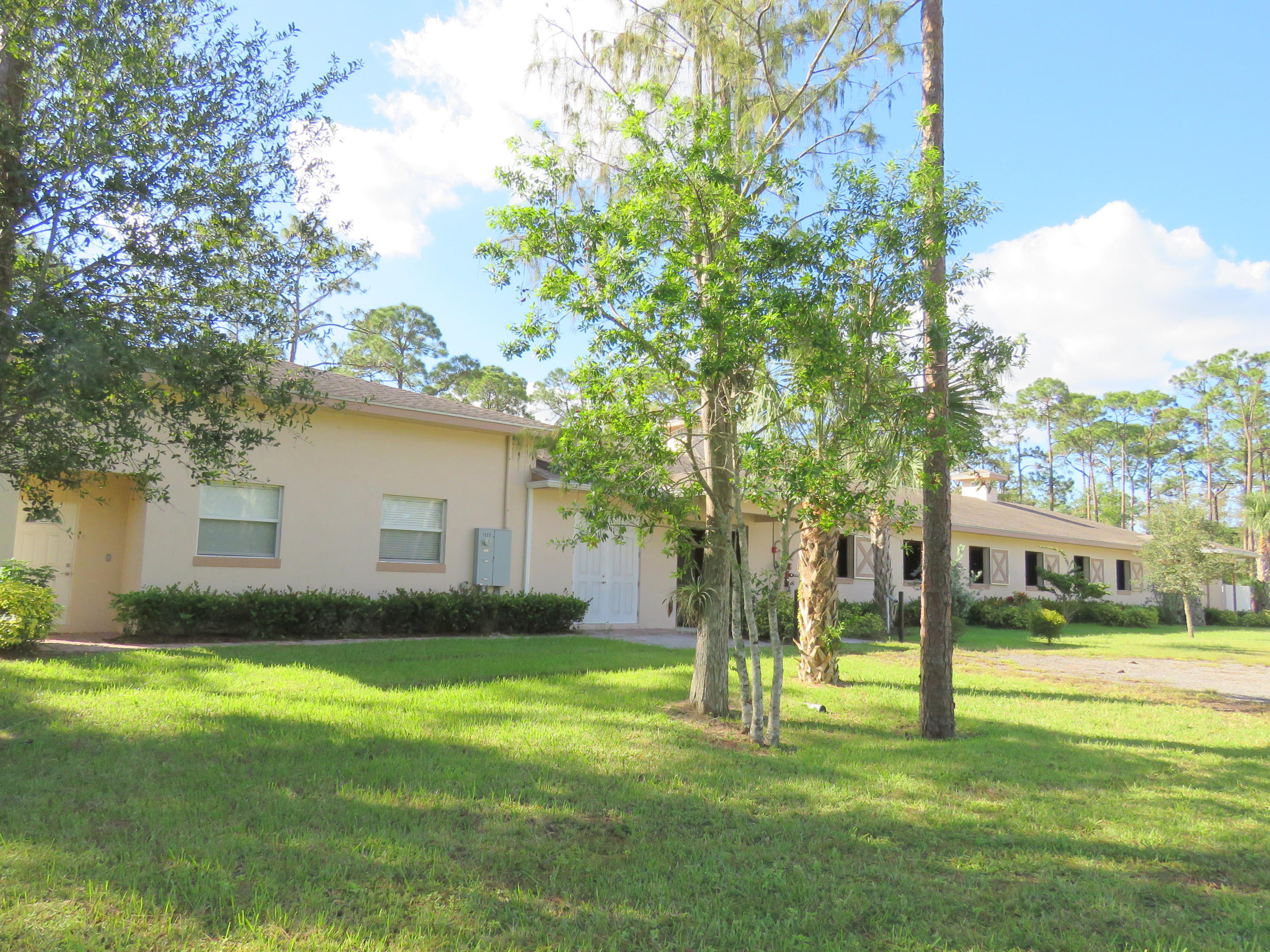1059 E Road Loxahatchee, FL 33470 - Photo 41 of 82 a view of backyard of house with green space