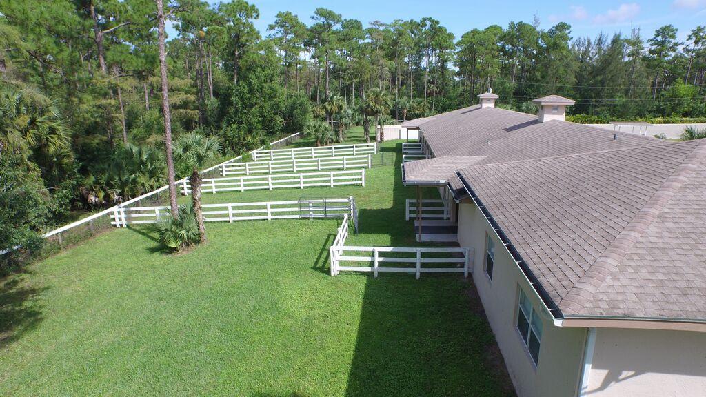 1059 E Road Loxahatchee, FL 33470 - Photo 5 of 82 a view of a deck with a backyard