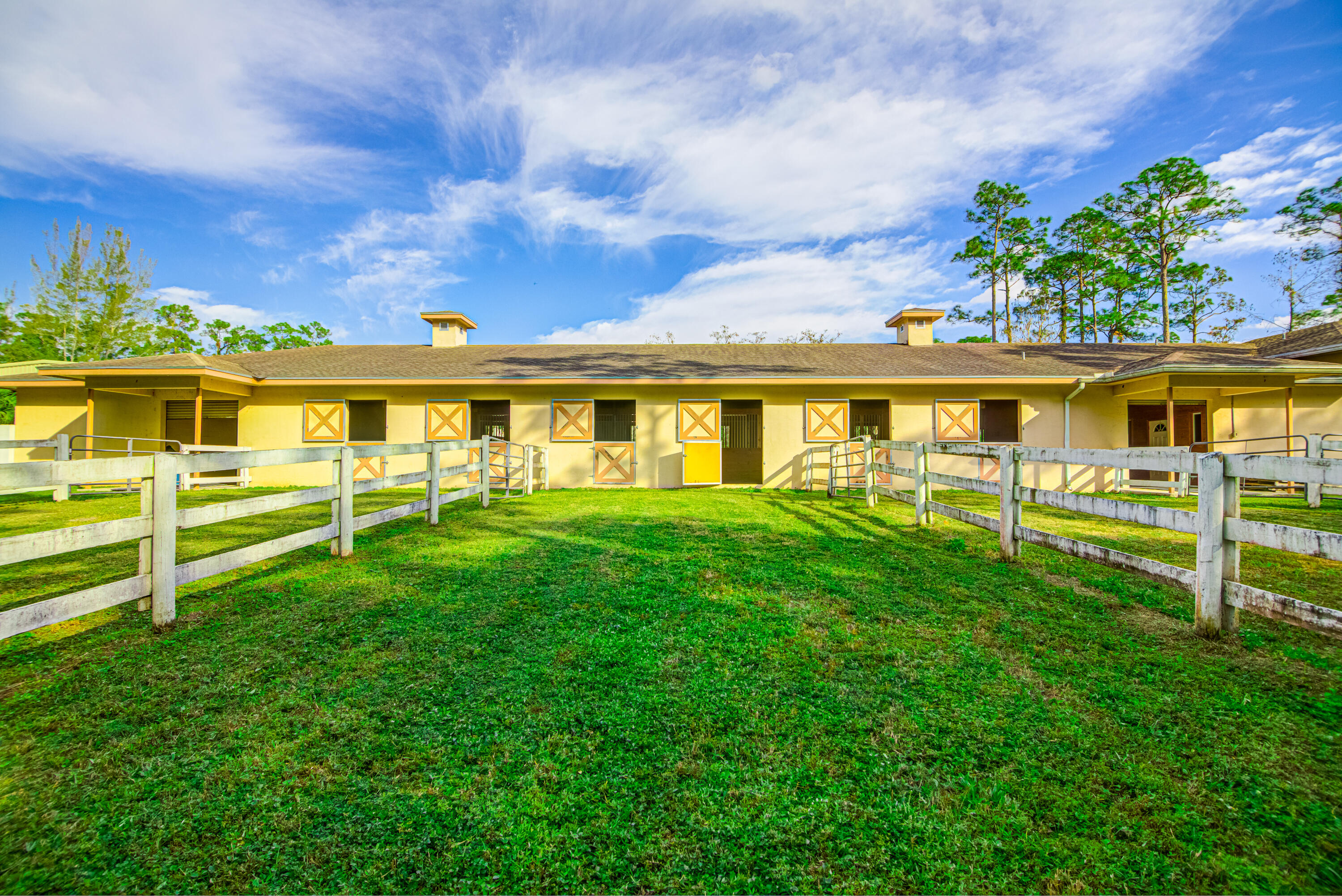 1059 E Road Loxahatchee, FL 33470 - Photo 70 of 82 a view of a house with a backyard