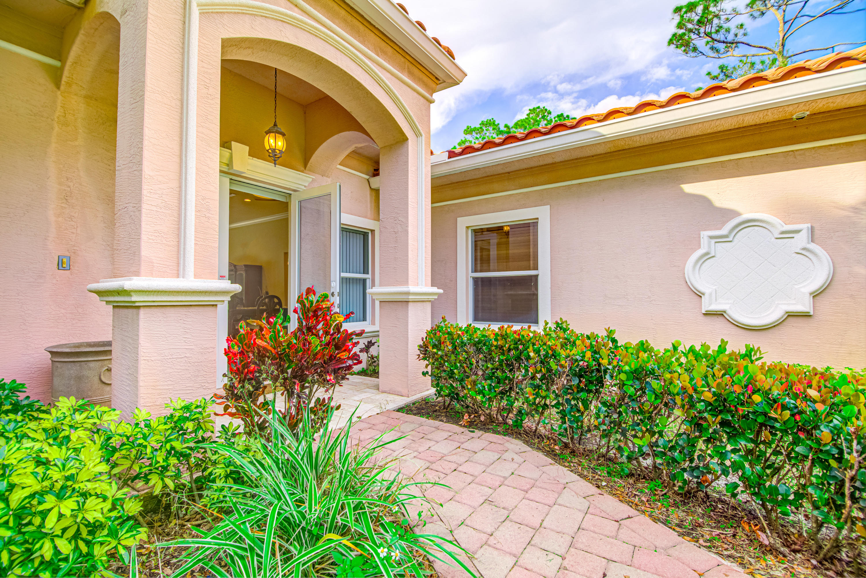 1059 E Road Loxahatchee, FL 33470 - Photo 8 of 82 a front view of a house with garden
