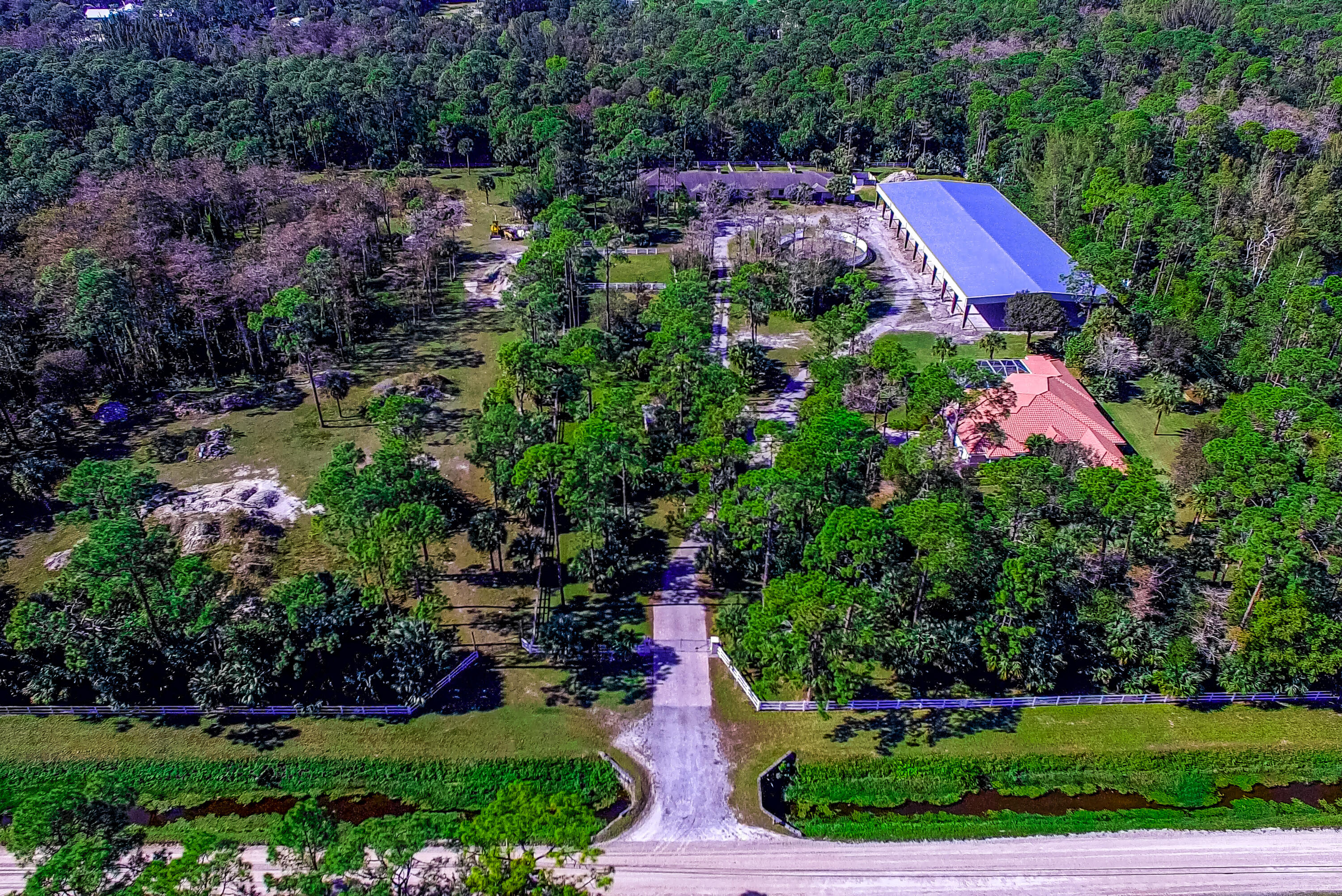1059 E Road Loxahatchee, FL 33470 - Photo 82 of 82 a aerial view of a house with a yard and garden