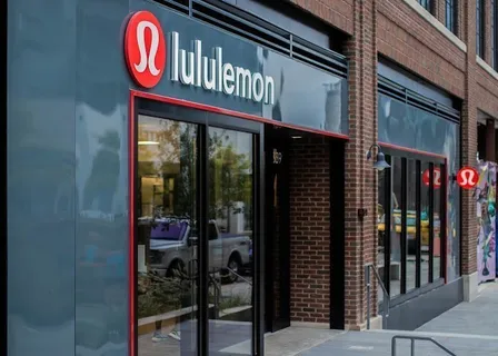 a view of a brick building with a bench in front of building