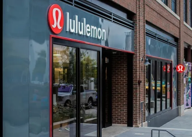 a view of a brick building with a bench in front of building