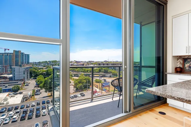 a view of a balcony with lake view and wooden floor