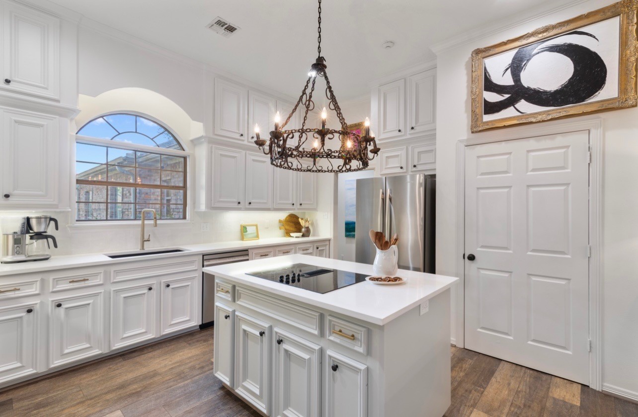 901 Longmire Road, Unit 51 Conroe, TX 77304 - Photo 5 of 48 Island cooktop in gorgeous segretto color (Segretto out of Memorial Houston) and Segretto colors throughout home. All art kitchen by owner can stay.