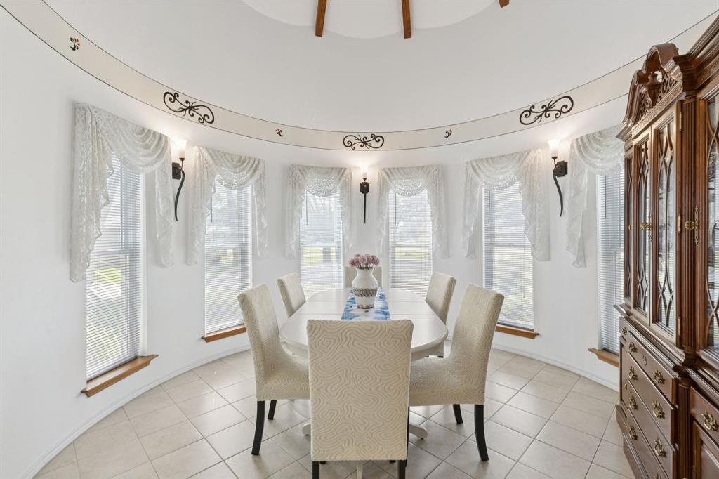 231 Rancho Vista Drive Double Oak, TX 75077 - Photo 11 of 26 a view of a dining room with furniture window and front door
