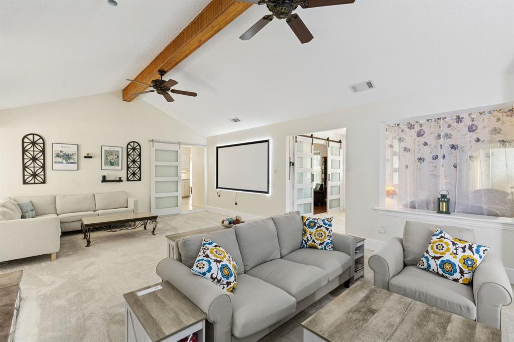 231 Rancho Vista Drive Double Oak, TX 75077 - Photo 5 of 26 a living room with furniture and a rug