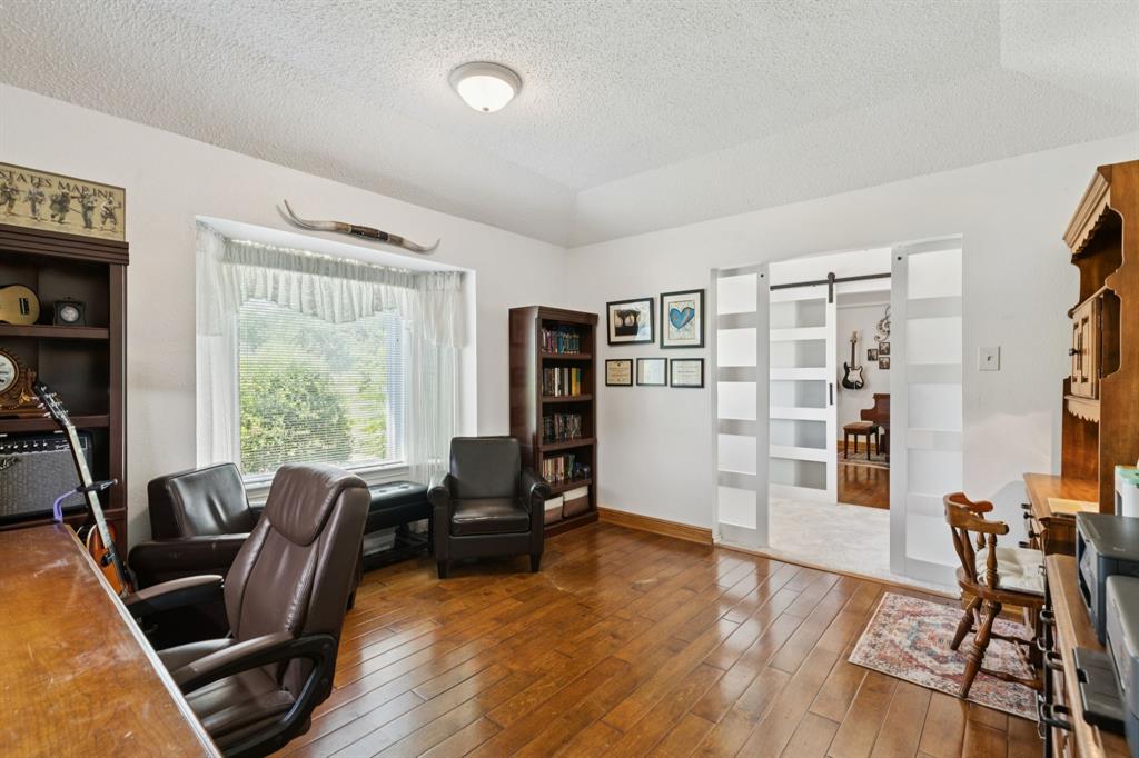 231 Rancho Vista Drive Double Oak, TX 75077 - Photo 6 of 26 a view of a livingroom with furniture and a window