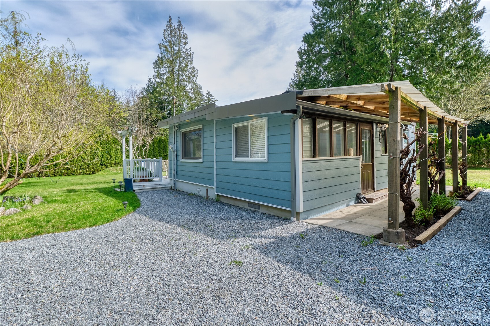 1871 Johnson Road Point Roberts, WA 98281 - Photo 16 of 36 a view of a house with a yard