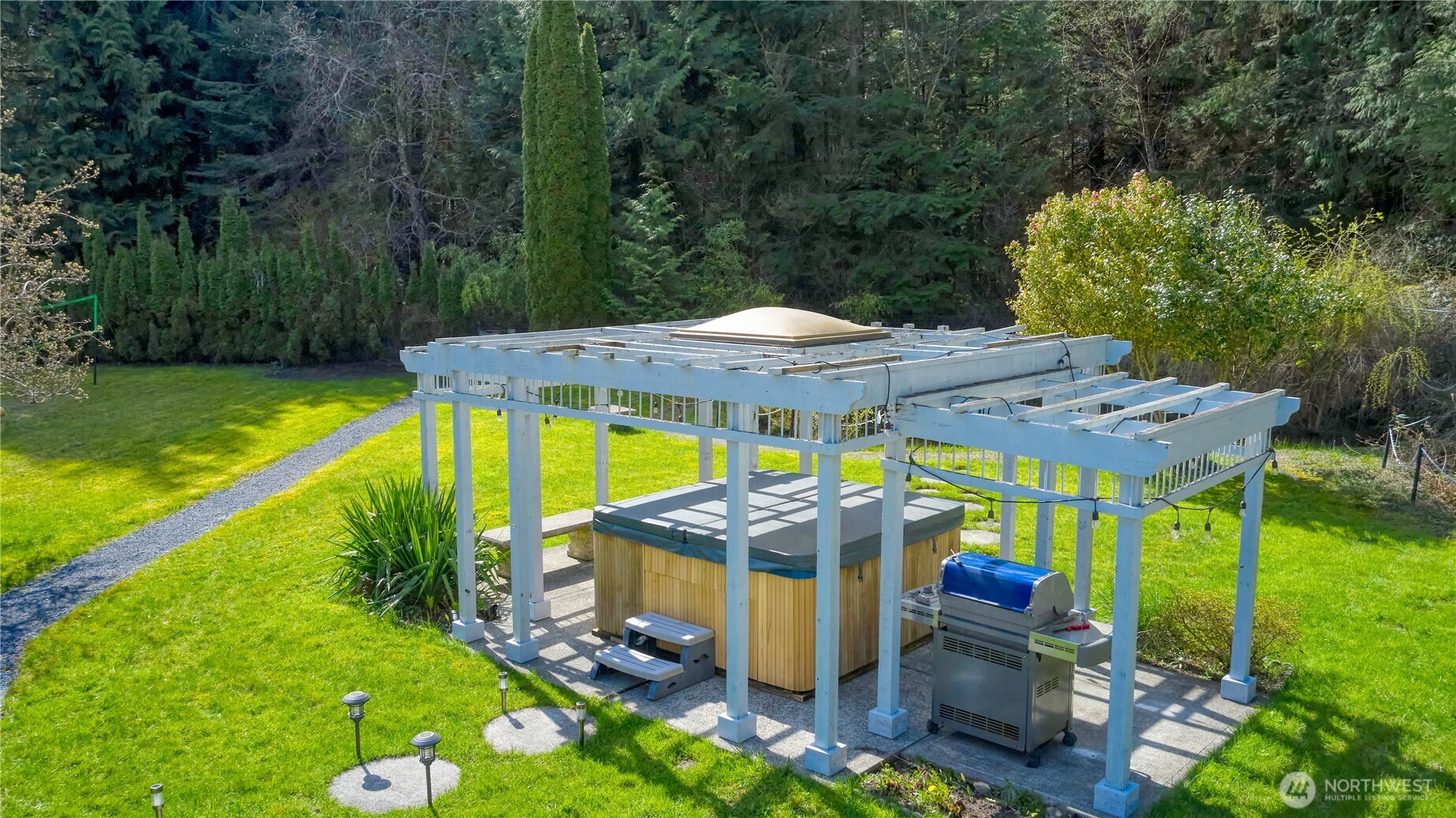 1871 Johnson Road Point Roberts, WA 98281 - Photo 24 of 36 an outdoor space with furniture and umbrella