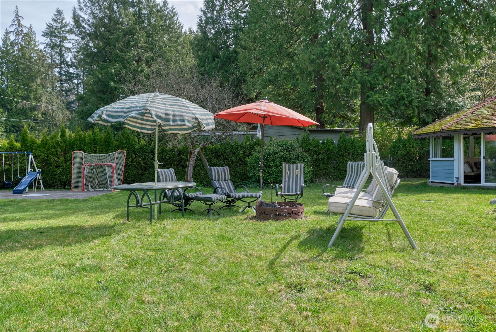 1871 Johnson Road Point Roberts, WA 98281 - Photo 29 of 36 a view of backyard with table and chairs under an umbrella