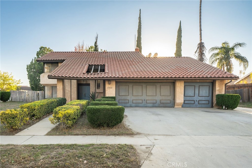 2044 North Riverside Avenue Rialto, CA 92377 - Photo 1 of 1 a front view of a house with a garden