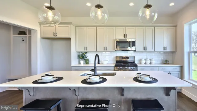 a kitchen with a sink and stove
