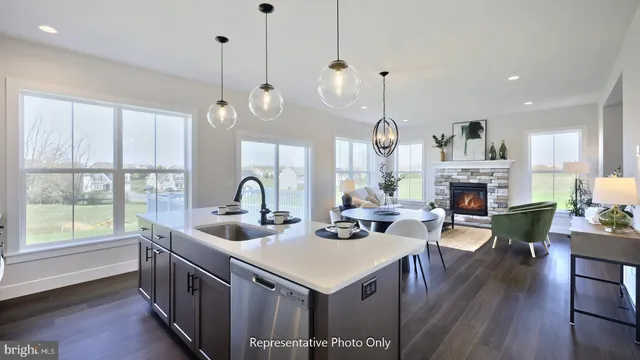 a very nice looking dining room with furniture window and wooden floor