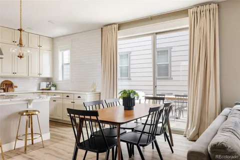 a view of a dining room with furniture and window
