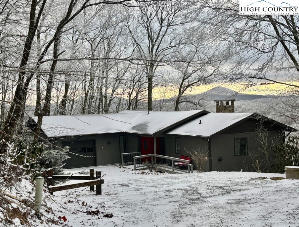 555 Glenview Road Newland, NC 28657 - Photo 35 of 49 a view of a chairs and table in backyard of the house