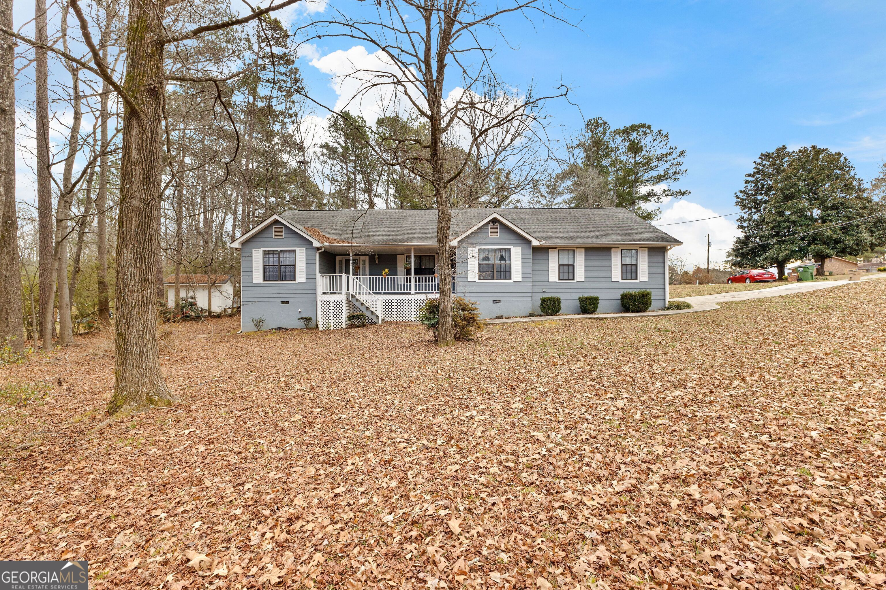 7834 Fielder Road Jonesboro, GA 30236 - Photo 1 of 1 front view of house with a yard
