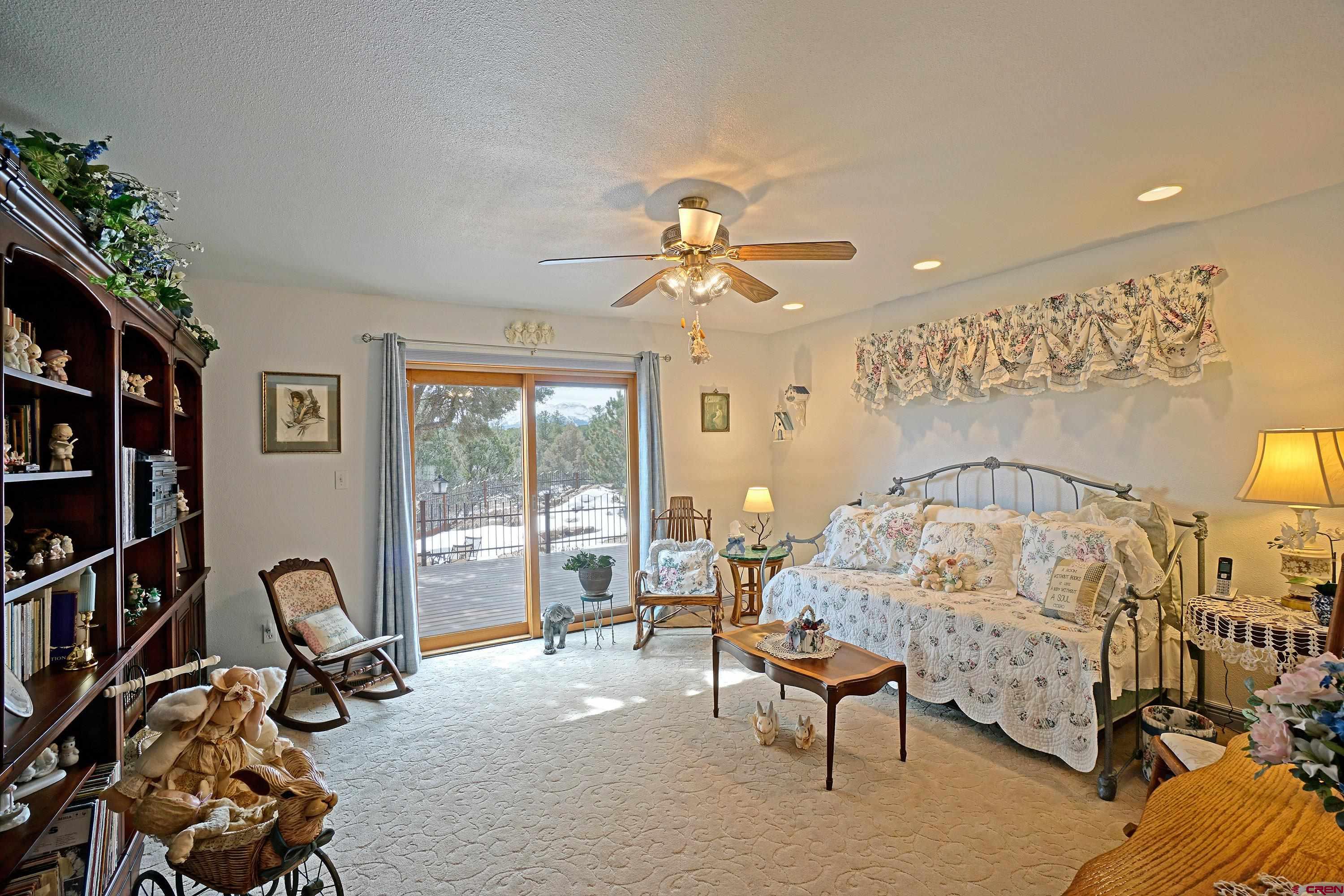 221 Waterview Lane Ridgway, CO 81432 - Photo 14 of 43 a bedroom with furniture and a chandelier