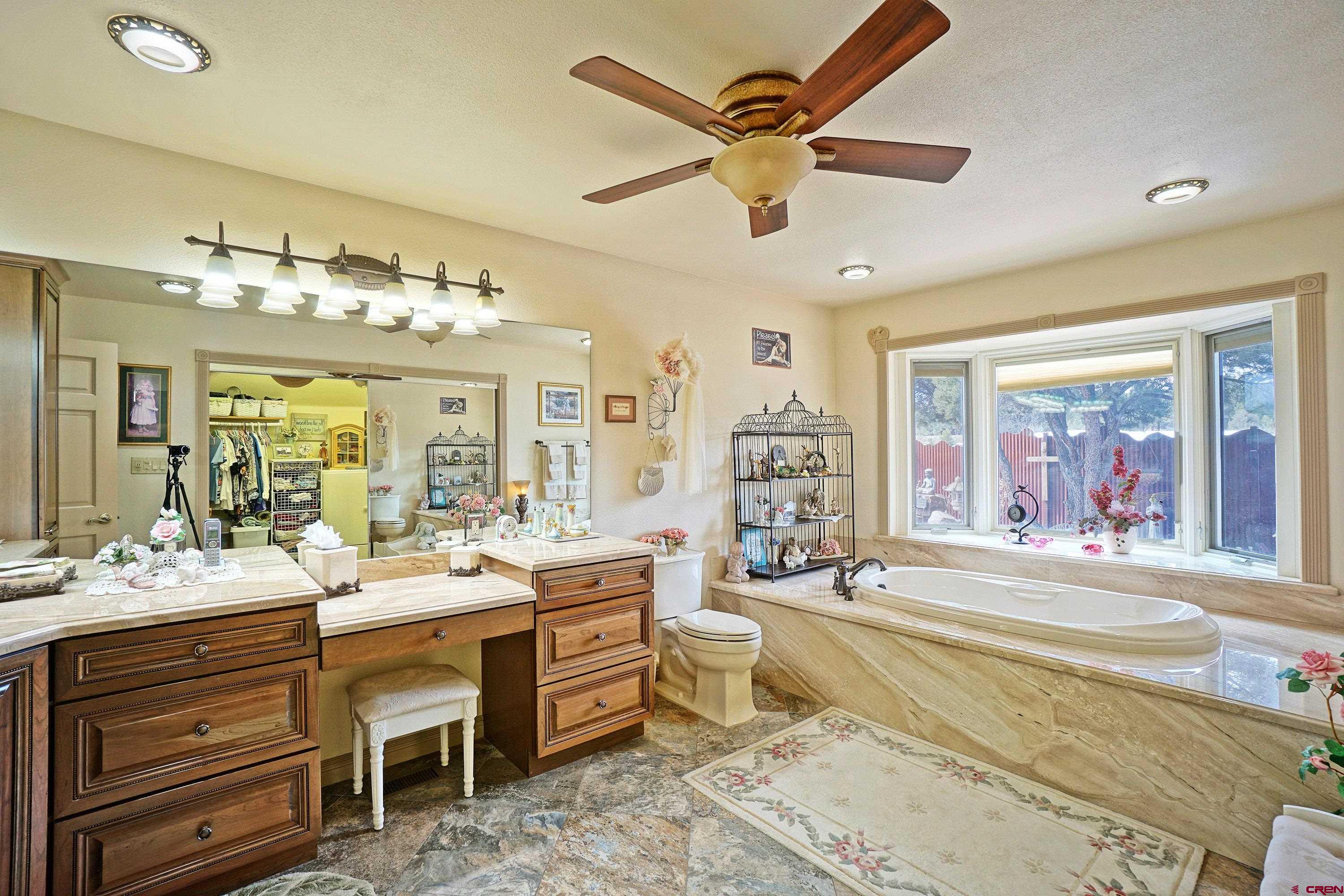 221 Waterview Lane Ridgway, CO 81432 - Photo 17 of 43 a large room with a large bed and a chandelier