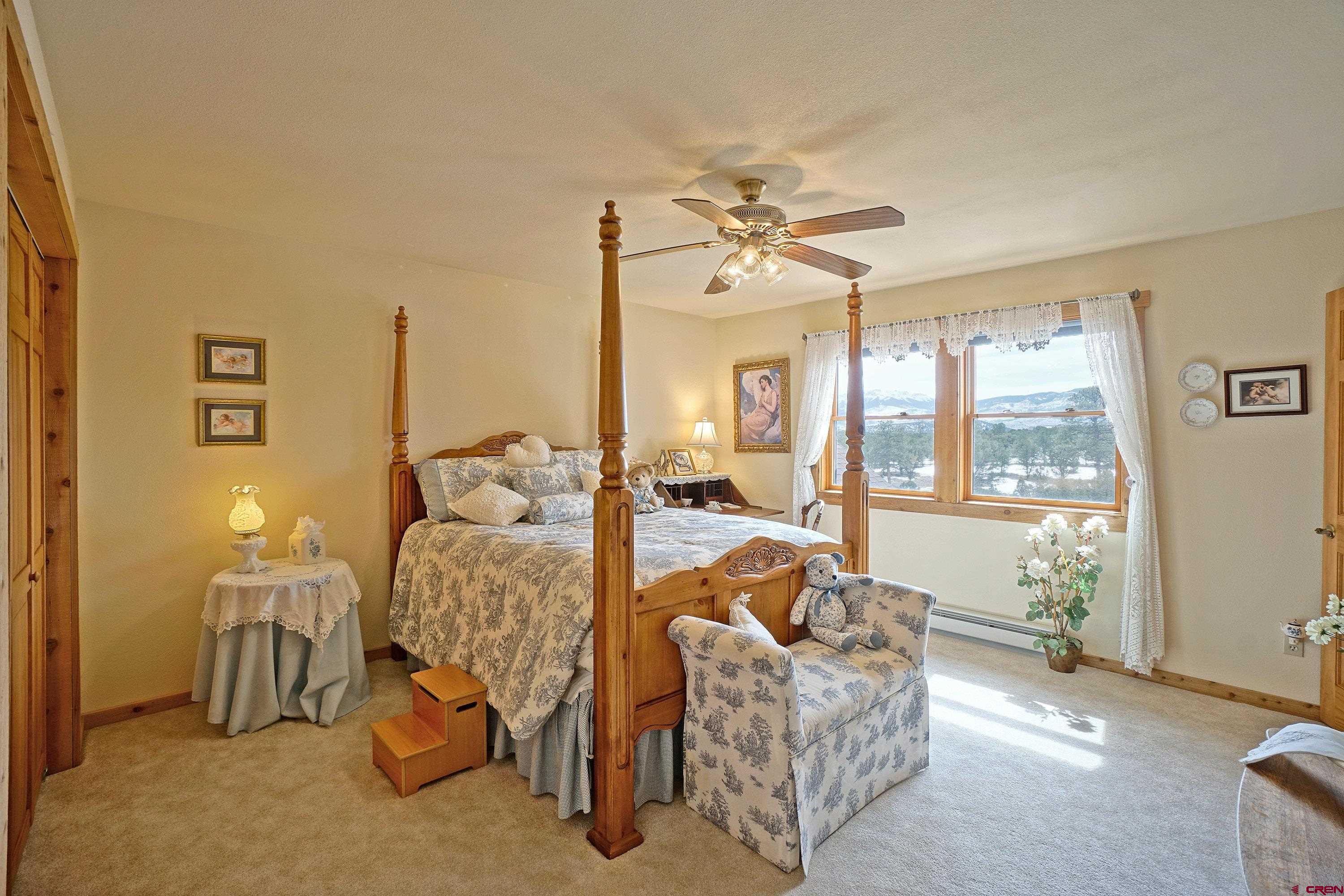 221 Waterview Lane Ridgway, CO 81432 - Photo 22 of 43 a living room with furniture and a large window