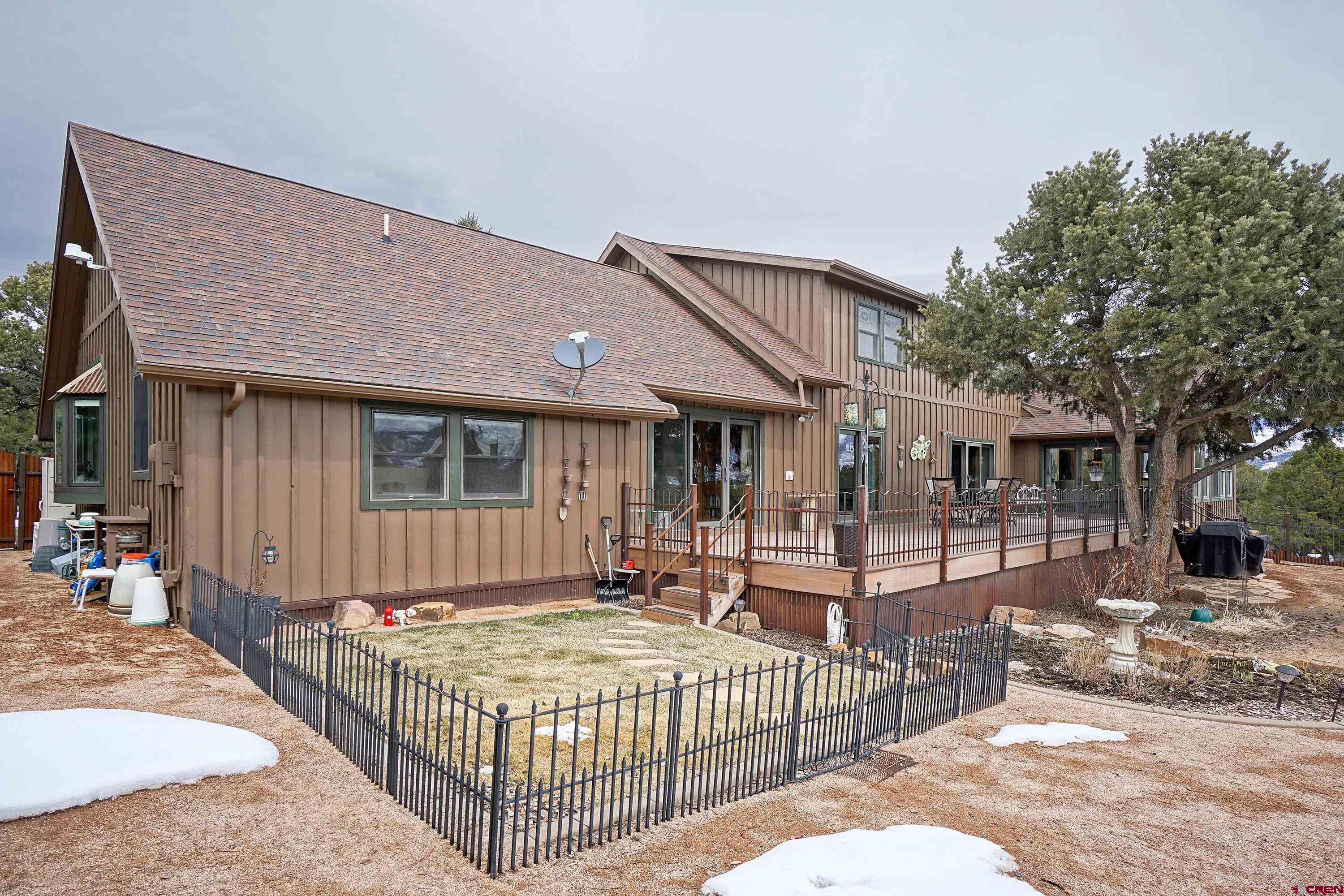 221 Waterview Lane Ridgway, CO 81432 - Photo 29 of 43 a front view of a house with glass doors