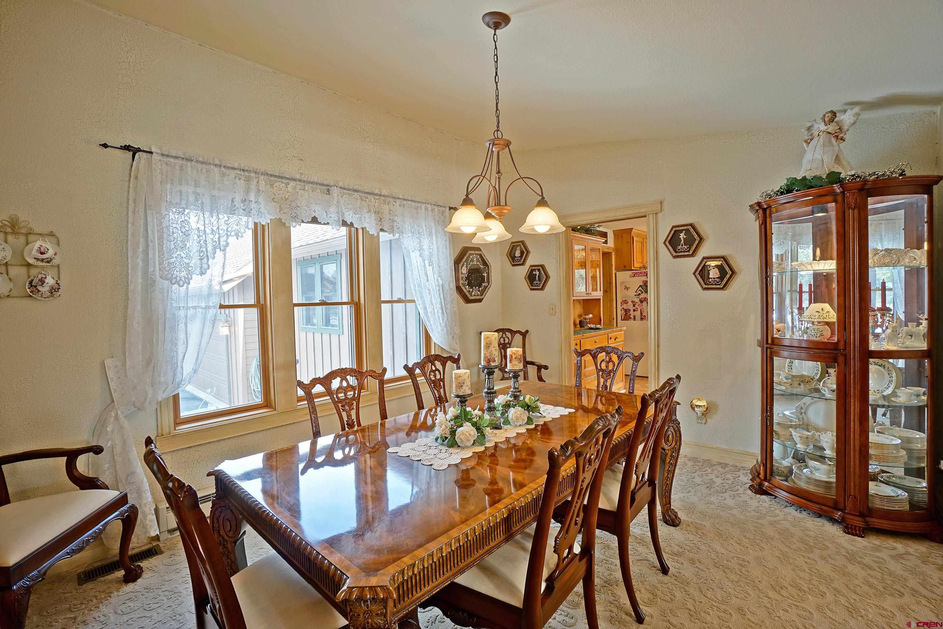 221 Waterview Lane Ridgway, CO 81432 - Photo 4 of 43 a dining room with furniture window wooden floor