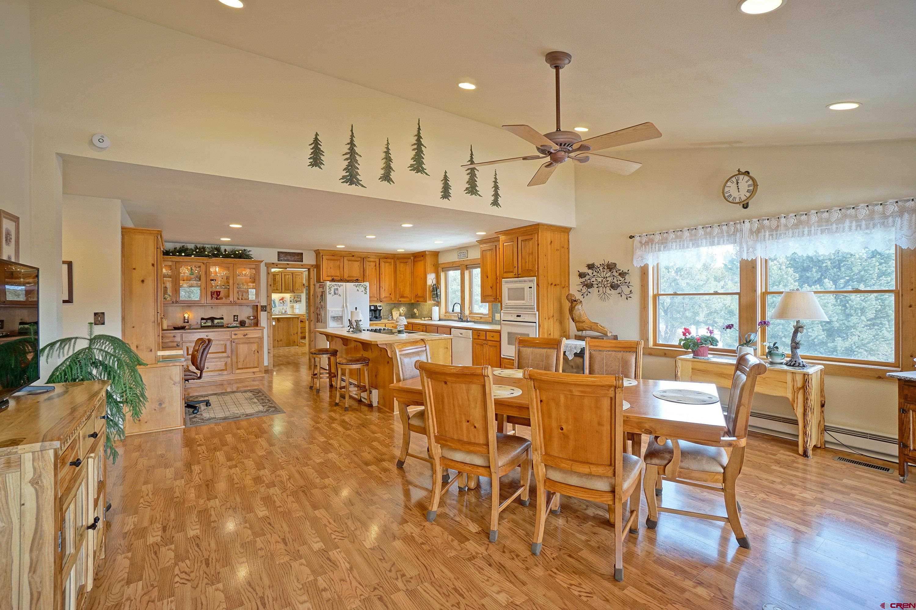 221 Waterview Lane Ridgway, CO 81432 - Photo 6 of 43 a view of a dining room with furniture wooden floor and chandelier