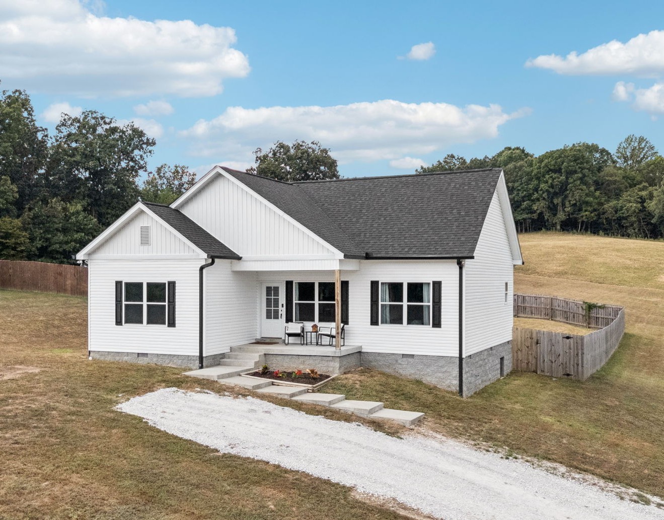 a view of a white house with a outdoor space