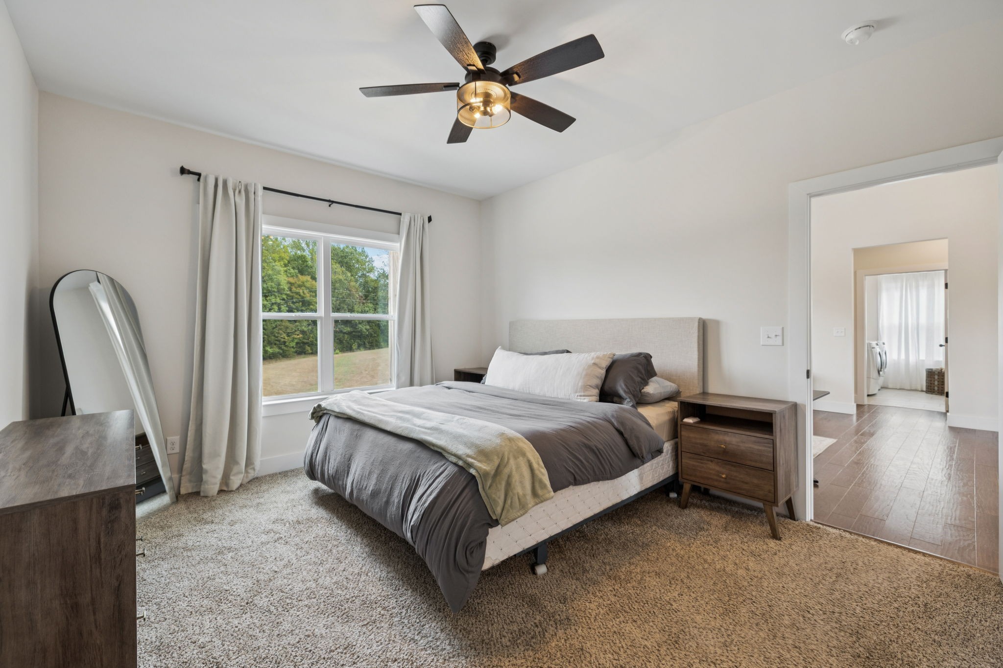 1220 Columbia Road Charlotte, TN 37036 - Photo 13 of 41 a bedroom with a bed and a chandelier