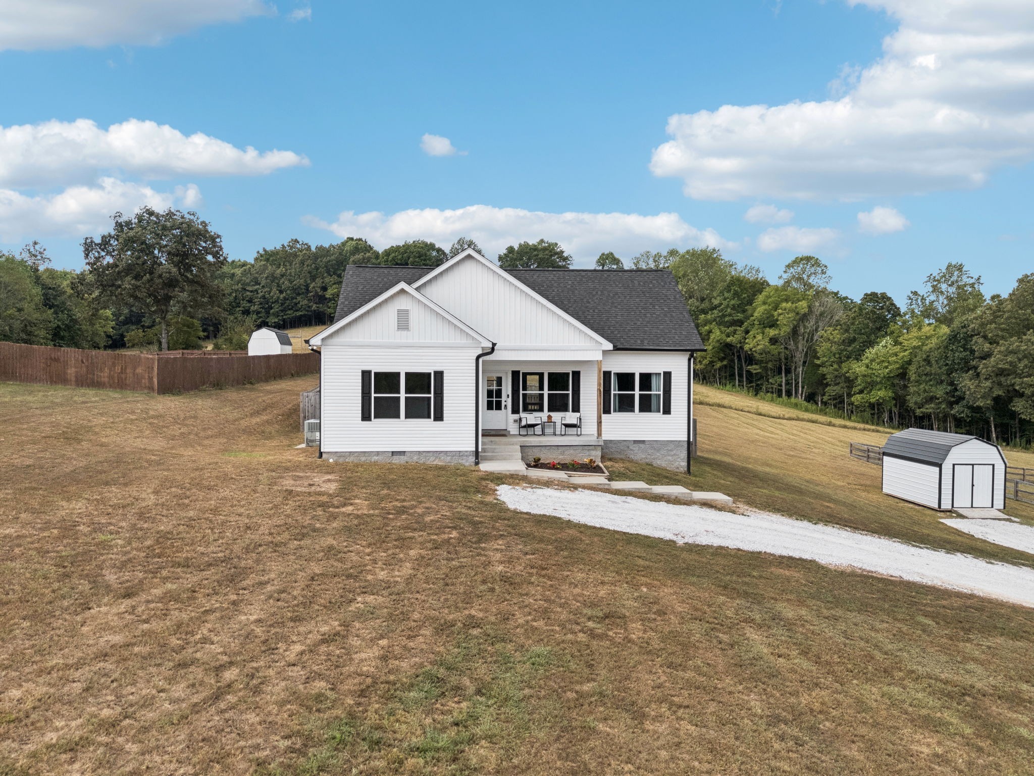 1220 Columbia Road Charlotte, TN 37036 - Photo 2 of 41 a front view of a house with a yard
