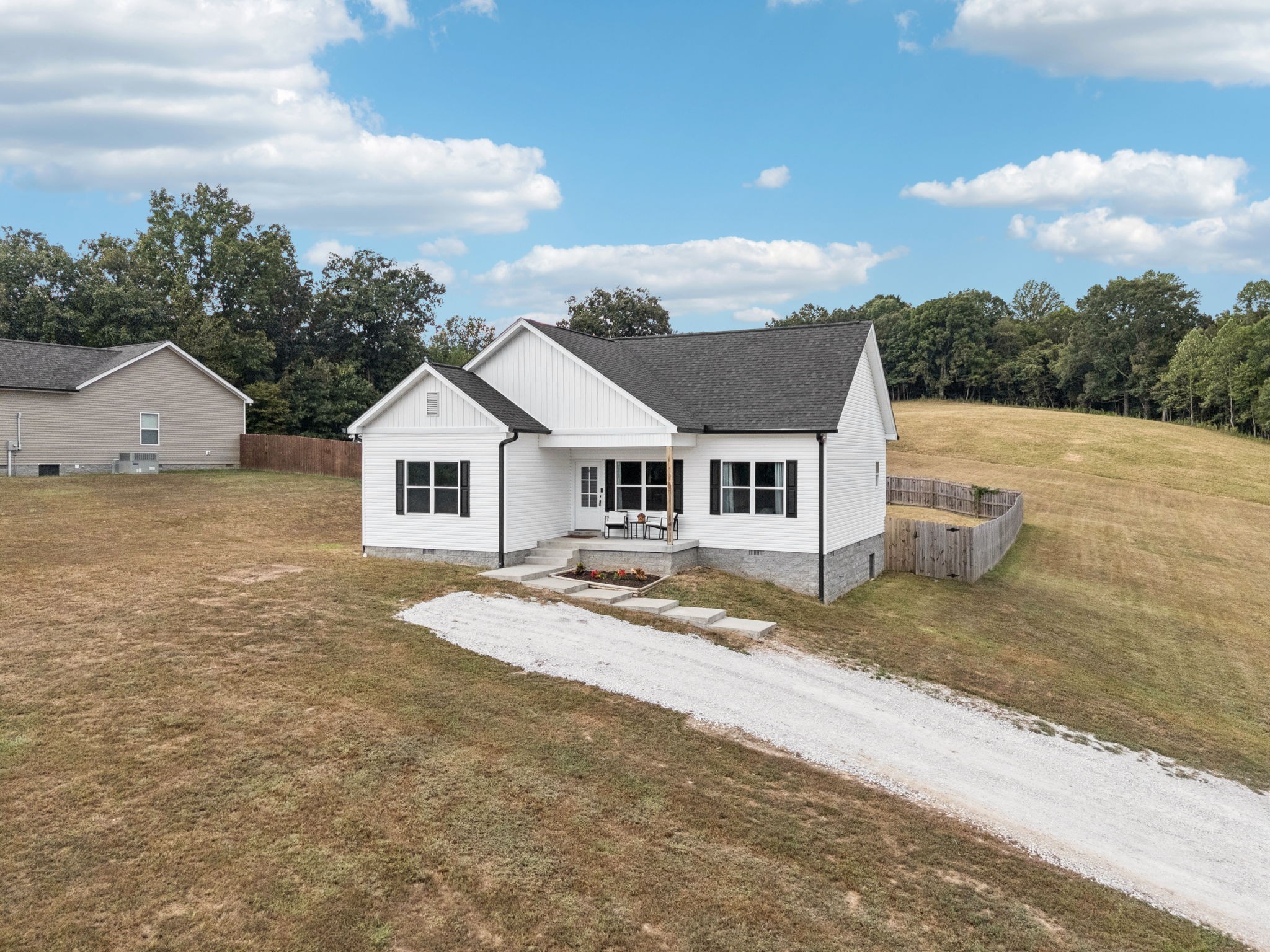 1220 Columbia Road Charlotte, TN 37036 - Photo 24 of 41 a view of a yard in front of a house with a large tree