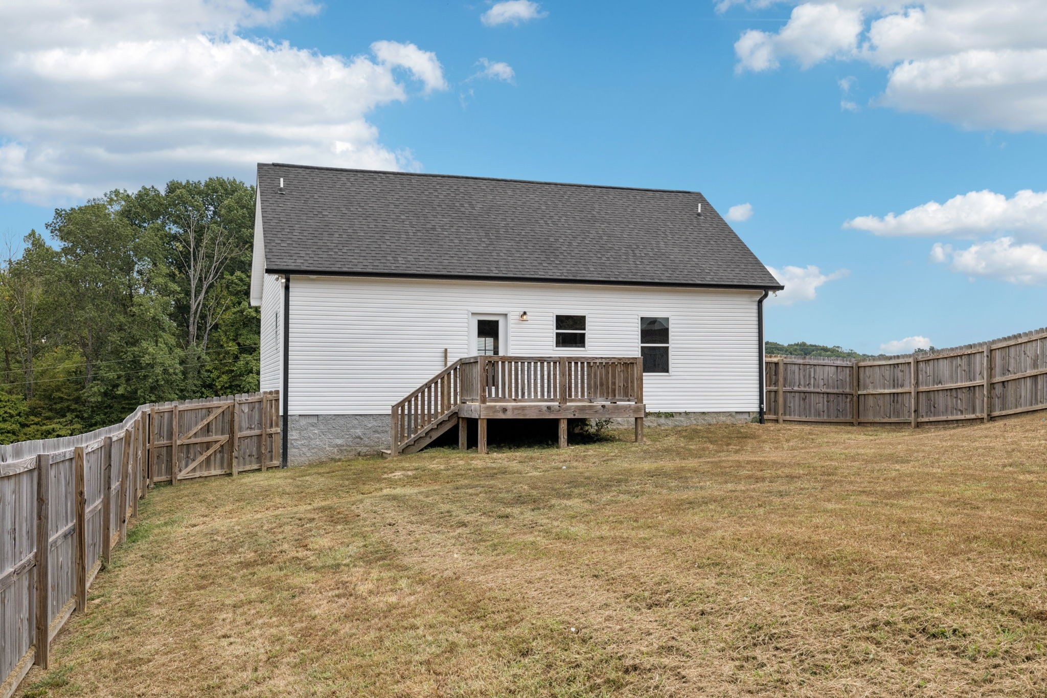1220 Columbia Road Charlotte, TN 37036 - Photo 33 of 41 a view of a house with a sink and wooden fence