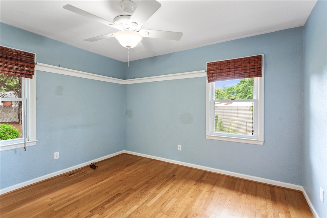 202 Keowee Trail Seneca, SC 29672 - Photo 18 of 35 This airy room features bright windows and hardwood flooring, perfect for a cozy retreat.