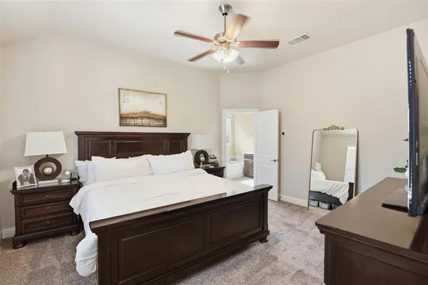 a bedroom with a bed and a table in it